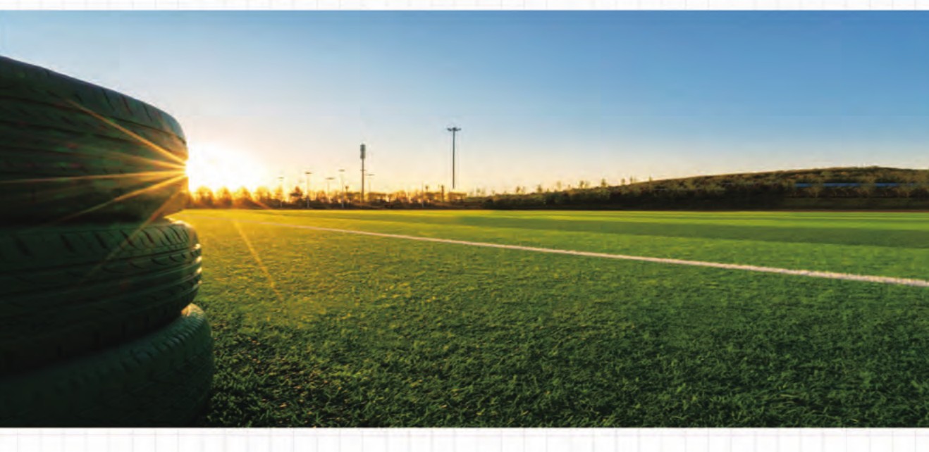 GreenVast artificial grass sports field at sunrise